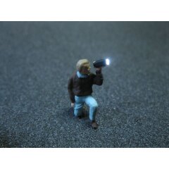 Figur mit LED Taschenlampe H0